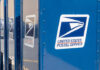 Row of blue United States Postal Service mailboxes