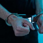 Close-up of hands in handcuffs