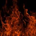 Close-up of vibrant flames against a black background