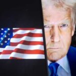 Trump Says Prepare for 4 to 5 Weeks Close-up of a political figure with an American flag in the background