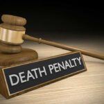 Death Penalty Vote SHOCKS Liberals Gavel beside death penalty sign on desk