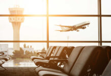 Trump Airport Name Sparks Political Backlash View of an airport terminal with an airplane taking off in the background