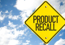 RECALL: Defective Product Causes BURNS Yellow product recall sign against cloudy sky