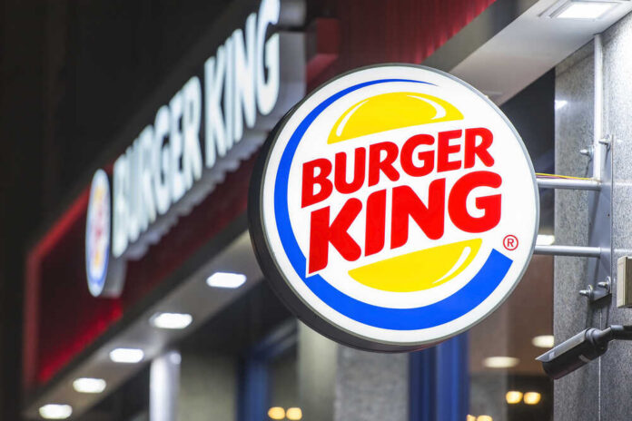 Illuminated Burger King sign at night