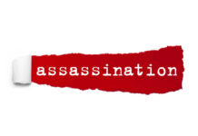 The word 'assassination' printed on a red torn paper background