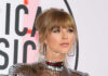 Taylor Swift in reflective outfit.