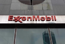 ExxonMobil logo displayed on a glass building