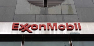 ExxonMobil logo displayed on a glass building