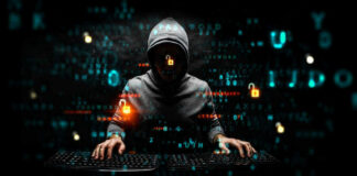 Hacker wearing a hoodie with digital codes overlaying.
