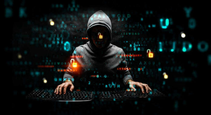 Hacker wearing a hoodie with digital codes overlaying.