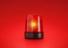 Red emergency light on red background