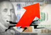 Red arrow on cracked $100 bill.