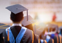 Graduates wearing caps and gowns in a ceremony.