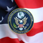National Counterterrorism Center emblem on an American flag background