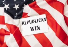 A notepad with the words 'REPUBLICAN WIN' on an American flag background