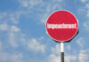 Impeachment Bombshell Hits Trump Red sign with the word Impeachment against sky
