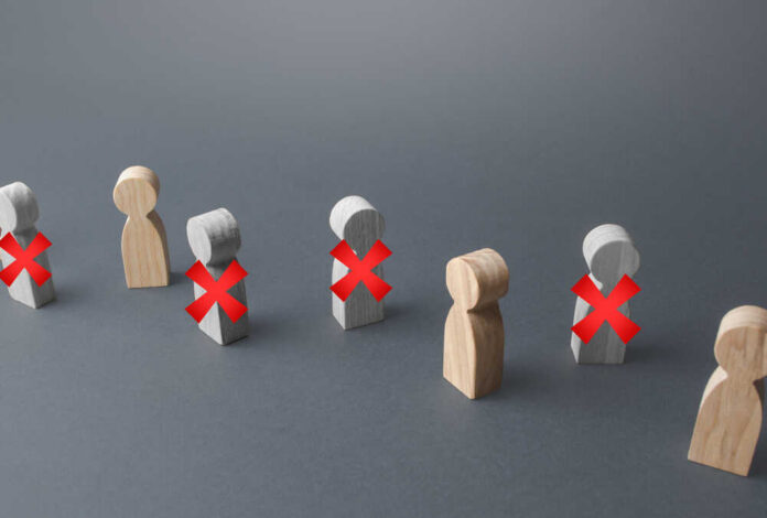 Line,Of,People,With,Red,X.,Loss,Of,Jobs,And Wooden figures representing people with red crosses indicating exclusion