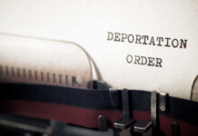 Shock Deportation: Maduro Ally Back in U.S. Close-up of a typewriter with a paper showing the words 'DEPORTATION ORDER'