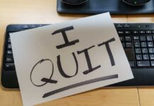 Border Boss Quits: Hidden Power Struggle? A resignation letter reading 'I QUIT' placed on a keyboard