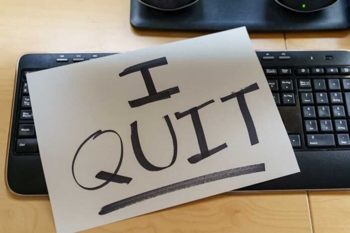 Note,On,A,Keyboard,With,The,Text,I,Quit.,Great A resignation letter reading 'I QUIT' placed on a keyboard