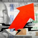Red arrow on cracked $100 bill.