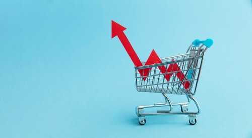 A shopping cart with red arrows indicating growth on a blue background