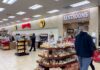 Interior of a Buc-ee's convenience store with snack displays and a restroom sign
