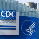 Cruise Ship Virus Panic — CDC Pushback Signage of the CDC building displaying its name and logo