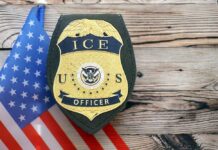 ICE Officer Charged — Video Exposed False Claims ICE officer badge displayed next to the U.S. flag