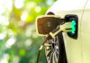 $9 BILLION ELECTRIC VEHICLE BET CRASHES Electric car charging at a charging station.