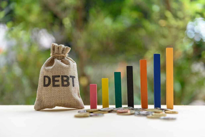 1131624908 Debt sack with rising financial graph bars.