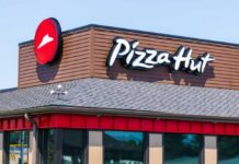 Taco Bell Ascends, Pizza Hut Axed Exterior view of a Pizza Hut restaurant with a prominent logo