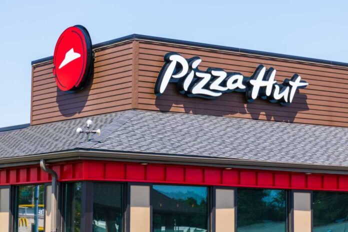 shutterstock_1150633346 Exterior view of a Pizza Hut restaurant with a prominent logo