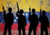 Trump’s Deadly Mission: Socialist Assist? Silhouettes of soldiers in front of the Venezuelan flag