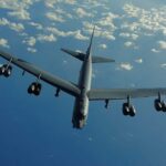 B-52 bomber flying against a blue sky
