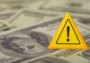 Taxpayer Cash Funneled — Who Was Supposed To Win? A yellow warning sign placed on a background of dollar bills
