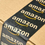 Amazon Item Recalled Over DEADLY Choking Risk Close-up of an Amazon-branded shipping box tape on a cardboard box