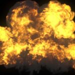 A large explosion with flames and smoke against a dark background