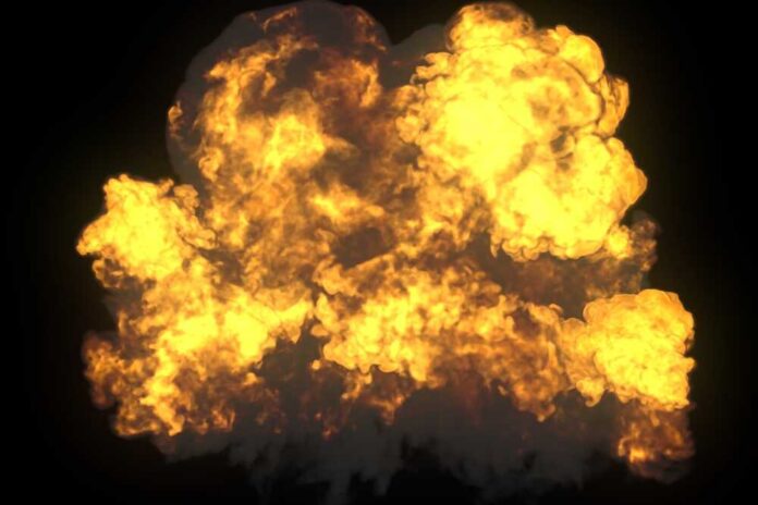 A large explosion with flames and smoke against a dark background