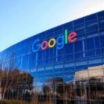 Google logo on office building exterior glass.