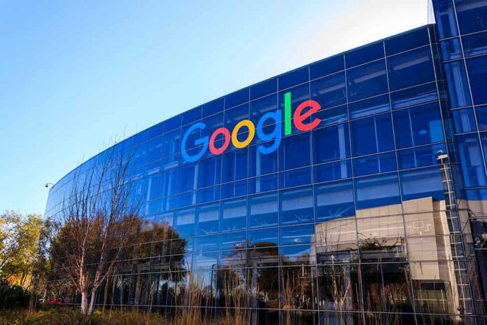 Google logo on office building exterior glass.