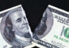 Paying More, Bringing Home Less A torn hundred dollar bill featuring Benjamin Franklin