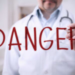 Third Death, Still No Answers Doctor writing danger on transparent screen