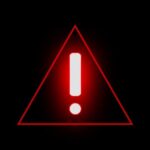 Red warning triangle with exclamation mark on black background