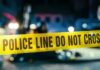 Museum Alarms Stalled — Thieves Stroll Out Police line caution tape at a crime scene with blurred figures in the background
