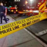 Tesla Trunk Horror Stuns LA Los Angeles police tape at night crime scene.