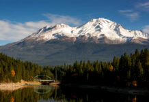 Mount Shasta Horror Slide — She Lives Snow-covered mountain peak partially obscured by clouds