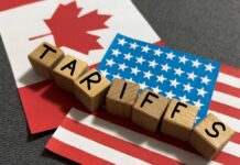 Tariff Smoke Bomb Stuns Ottawa Canada and U.S. flags at an airport.