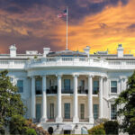 Inside Bets Rock White House The White House with vibrant sunset sky.