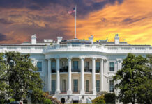 Inside Bets Rock White House The White House with vibrant sunset sky.